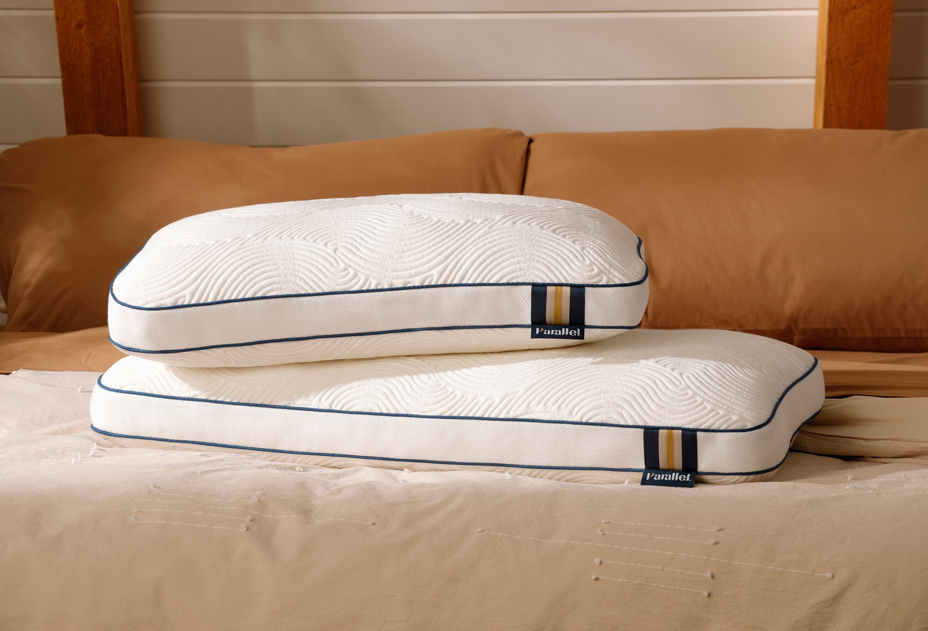 2 high profile high-end pillows stacked on stylish bed